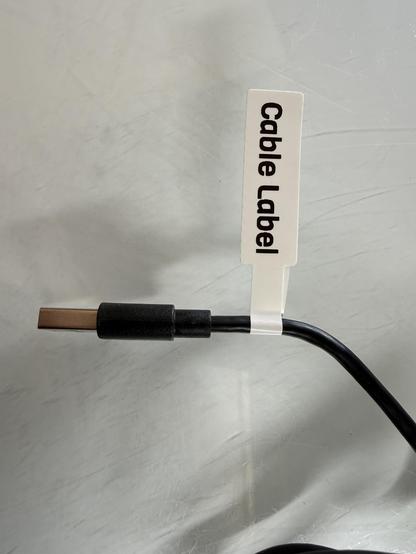 Cable with cable label applied and the cable label is labeled Cable Label. 