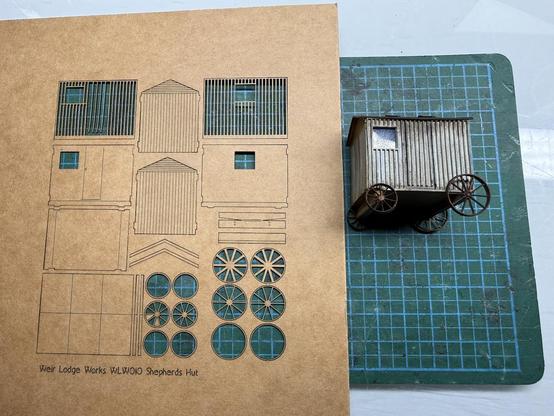 New laser cut version (since improved) sheet alongside the original model.